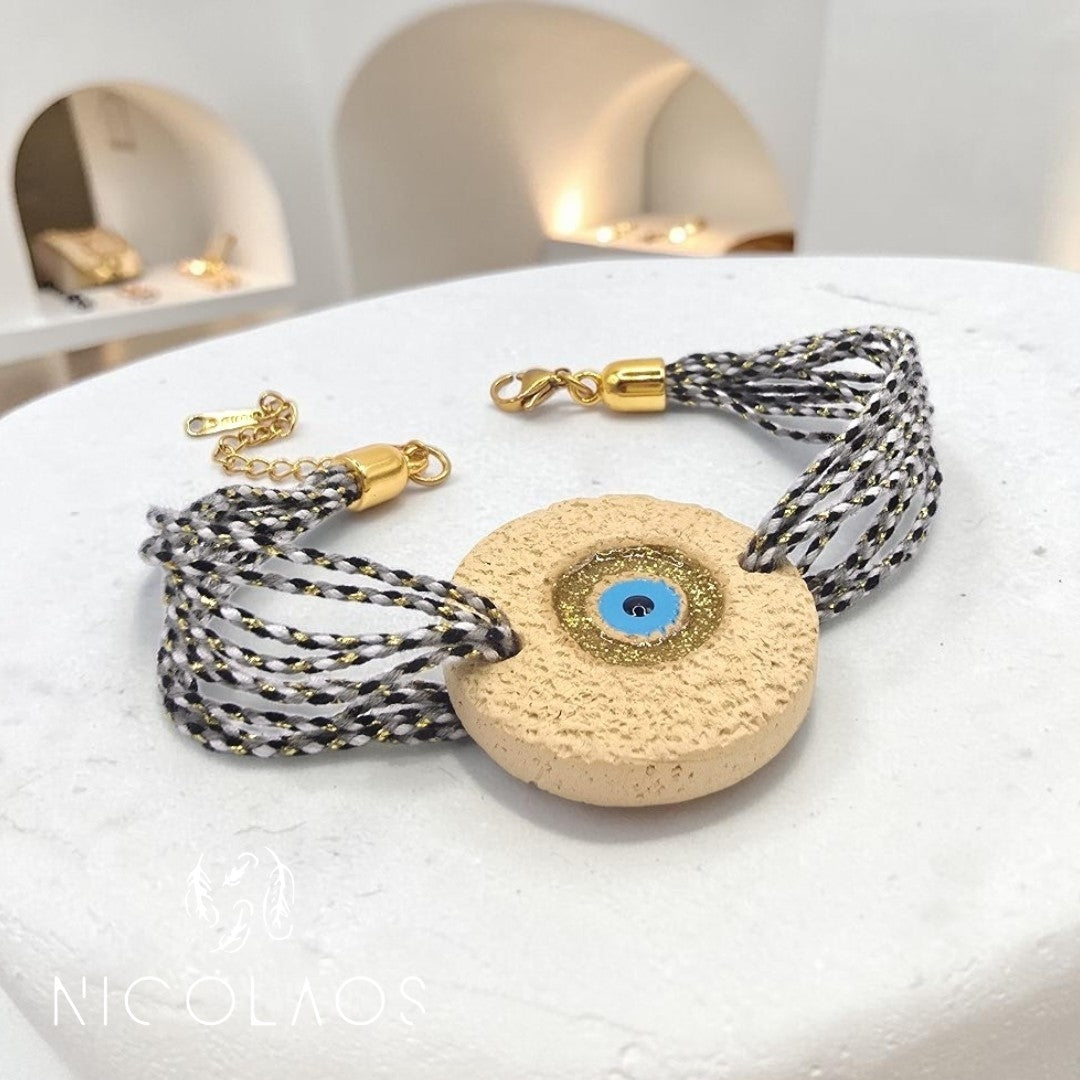 Χειροποίητο βραχιόλι 'Organeye' με κορδόνια χρυσοκλωστή και κεραμικό μάτι με βαφή σμάλτου